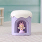 Purple mini night light humidifier with angel figurine in front window