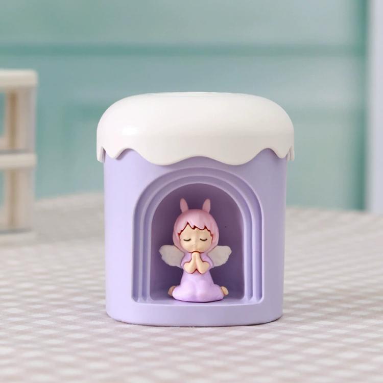 Purple mini night light humidifier with angel figurine in front window