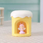 Yellow mini night light humidifier with angel figurine in front window
