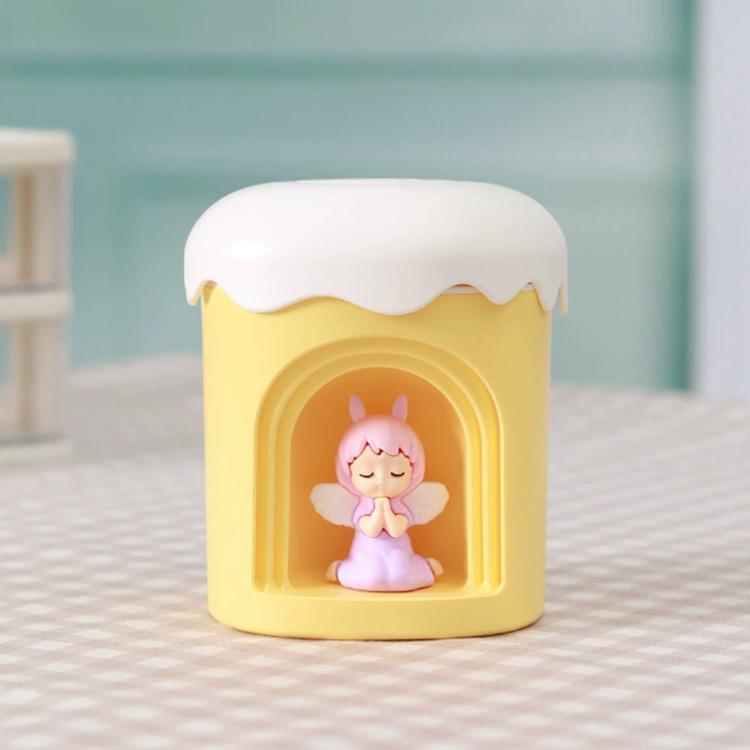 Yellow mini night light humidifier with angel figurine in front window