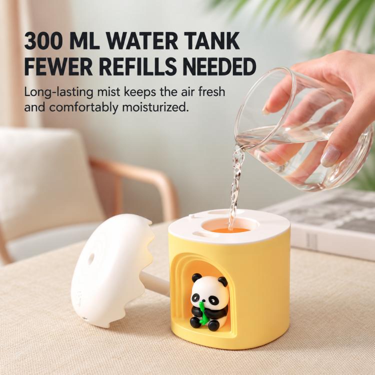 Yellow mini desktop night light humidifier with panda figure; water poured into top