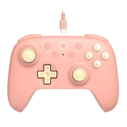 Wired youth gaming controller in peach with cream D-pad and round ABXY buttons