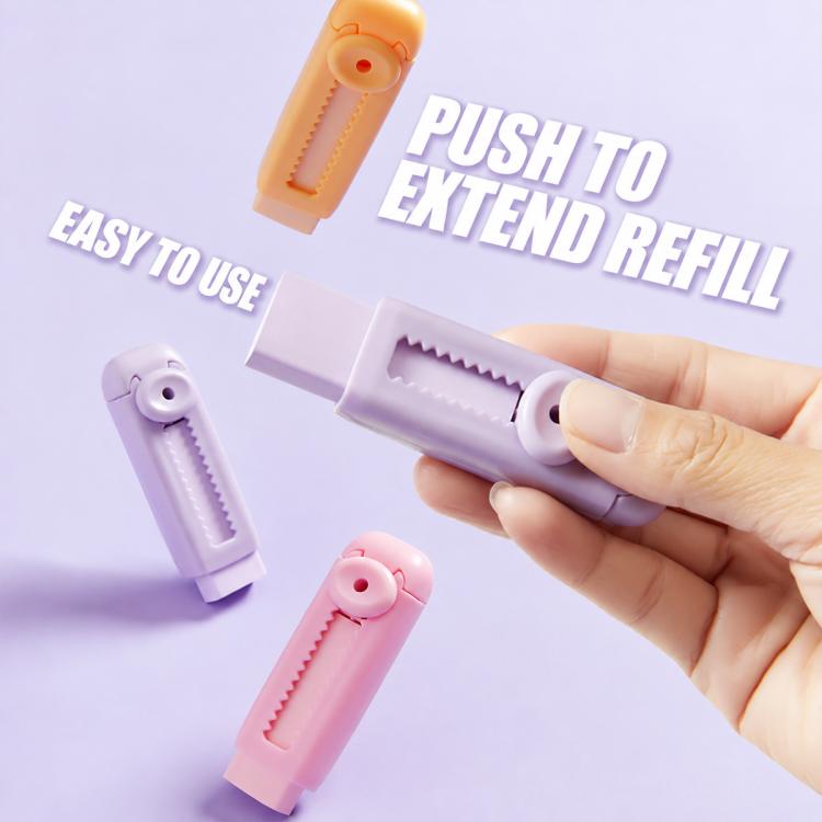 Hand pushing a purple refillable sliding eraser to extend the refill, with pastel models.