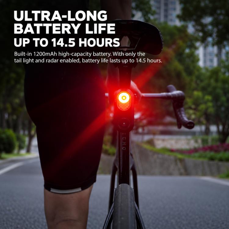 Cycling radar tail light with bright red rear light glowing on bike
