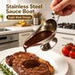 Stainless steel sauce boat with spout, pouring brown sauce onto a steak plate