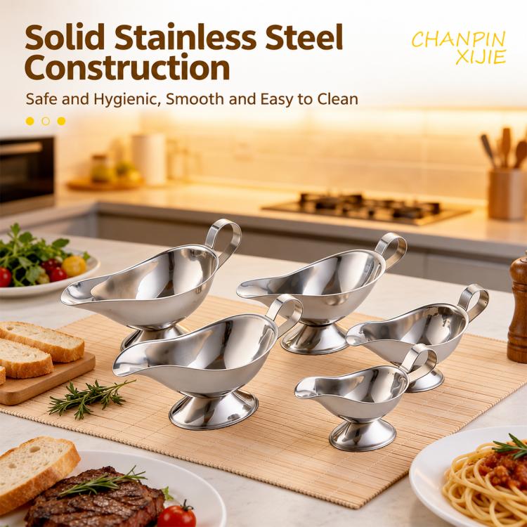 Set of stainless steel sauce boats with spouts and loop handles on a serving tray