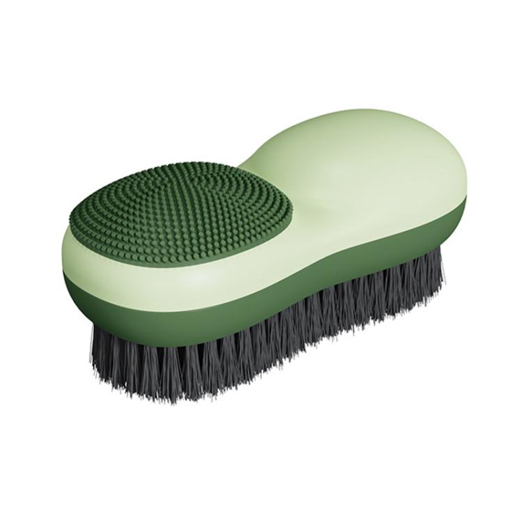 Green double-sided laundry brush with dark textured pad and dark bristle brush side