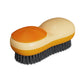 Orange and cream double-sided laundry brush with textured pad and dark bristle side