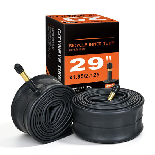 Rolled black inner tubes with American valve stems (AV48) near product box