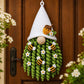 White and green crochet honeybee door hanger with bee appliques and small flowers