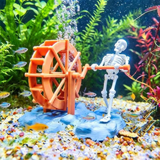 Orange air bubble skull waterwheel aquarium ornament with clear tube and base.