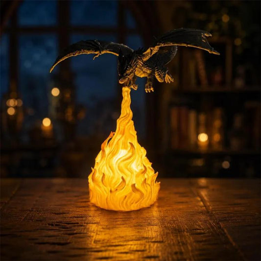 Black dragon night light with yellow flame base, open wings and glowing fire plume.