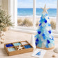 DIY sea glass Christmas tree craft with blue layered tree, star topper, and instruction sheet