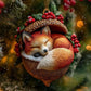 Fox Christmas ornament curled in a heart-shaped berry wreath with snowy accents