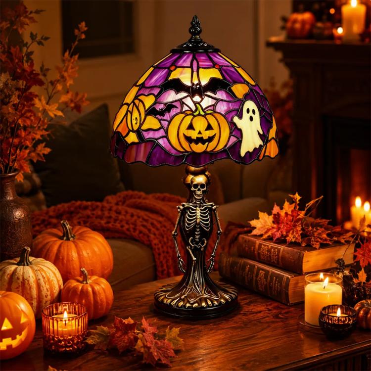 Halloween stained glass table lamp with purple shade, pumpkin and ghost motifs, skeleton base.