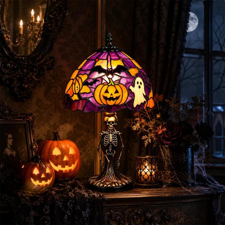 Spooky Halloween stained glass table lamp with purple pumpkin-and-ghost shade and skeleton base.