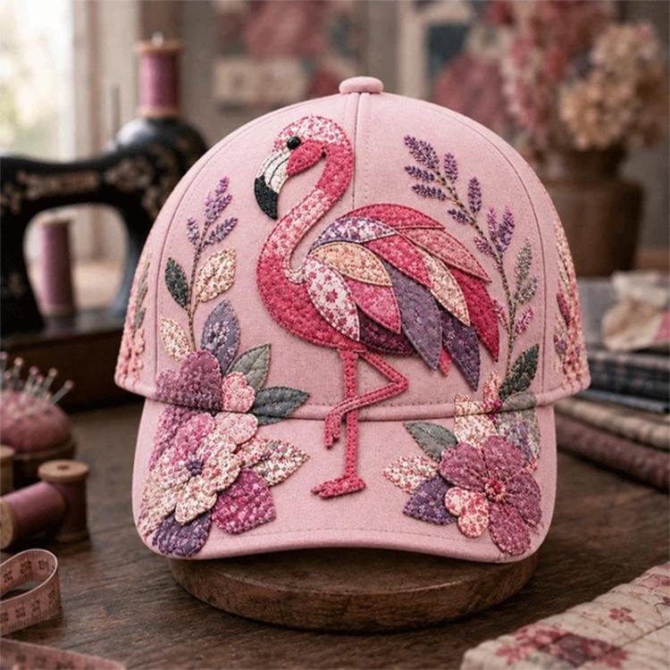 Pink embroidered cap with flamingo and floral design