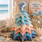 Patchwork Christmas tree ornament with gray dolphin topper and layered ocean-themed fabric