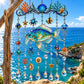 Acrylic fish hanging ornament with blue bead chains, seashell charms, and star dangles
