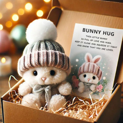 Mini bunny hug plush in gray knit beanie and striped outfit, in a gift box with card