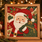 Framed Christmas fabric art kit featuring a Santa holding garland with decorative holly