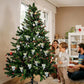 Glitter angel pendant ornaments hanging on a decorated Christmas tree