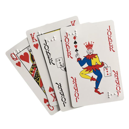 Fan of gray plastic playing cards with red/black suit faces and raised braille dots