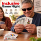 Hands holding gray plastic playing cards with red/black faces and raised braille dots