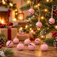 Pink small round painted bell charm with hanging loop and face lines.
