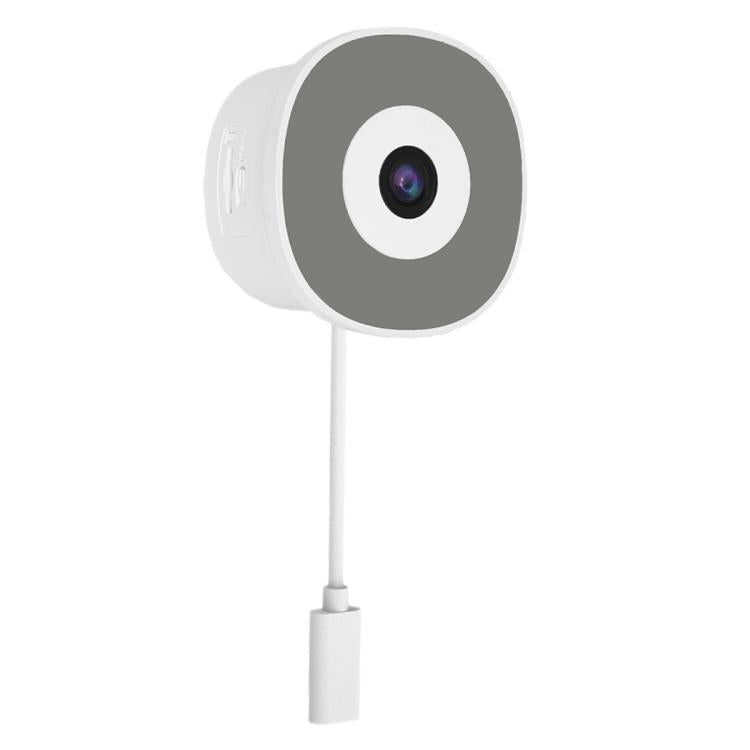 Glass-mounted smart security camera with white housing and dark round lens cover