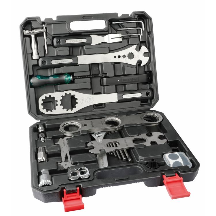 Open black bicycle tool kit case with metal wrenches, sockets, and red plastic tabs