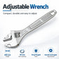 Silver adjustable wrench with engraved markings and open jaw for nuts and bolts