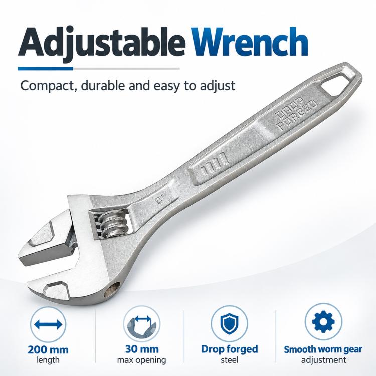 Silver adjustable wrench with engraved markings and open jaw for nuts and bolts