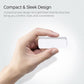 Compact white wireless magnetic door and window sensor held in two hands