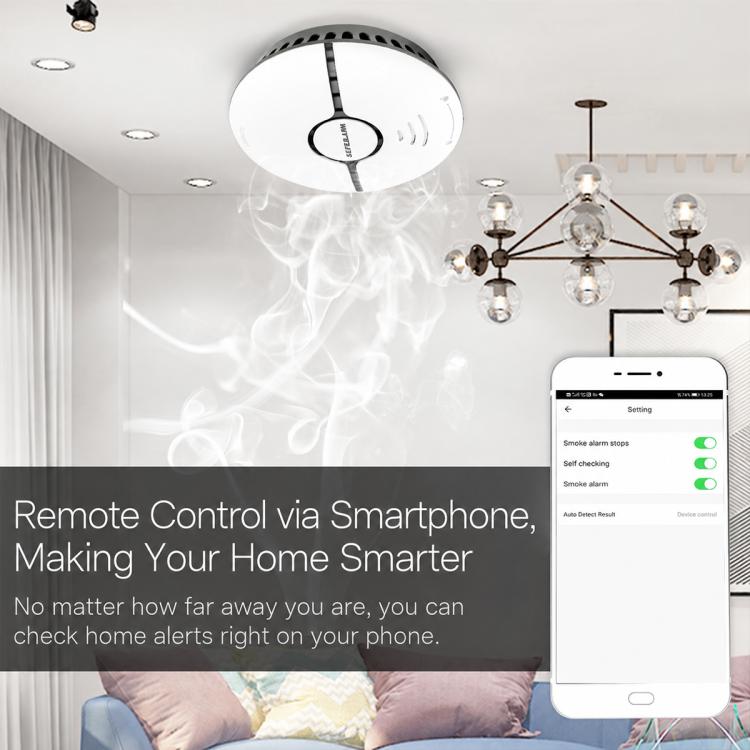 Ceiling-mounted round white smoke detector alarm with black center ring