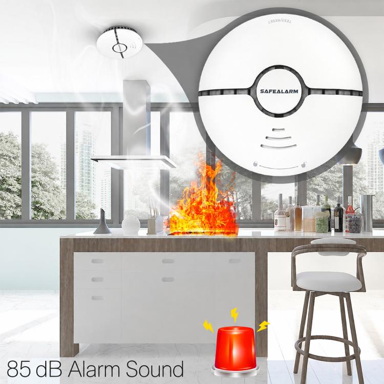 Round smoke detector alarm with black center ring and side vent openings