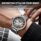 Men's automatic mechanical watch with taupe dial and silver steel bracelet on wrist