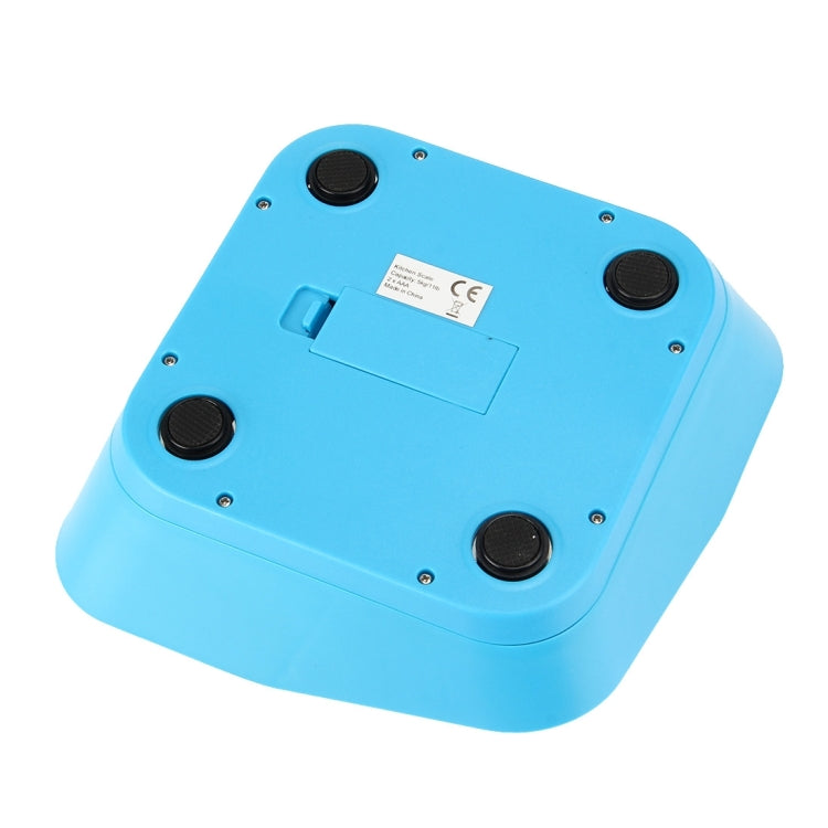 Blue bottom of bowl-shaped digital kitchen scale with four rubber feet