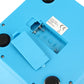 Close-up of battery compartment on blue bowl-shaped digital kitchen scale