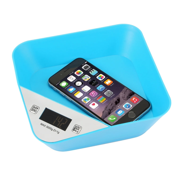 Blue bowl-shaped digital kitchen scale with smartphone resting on tray