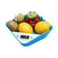 Blue bowl-shaped digital kitchen scale displaying food weight with fruit in tray