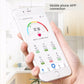 Smart body fat scale with LCD display and four oval foot pads behind a phone