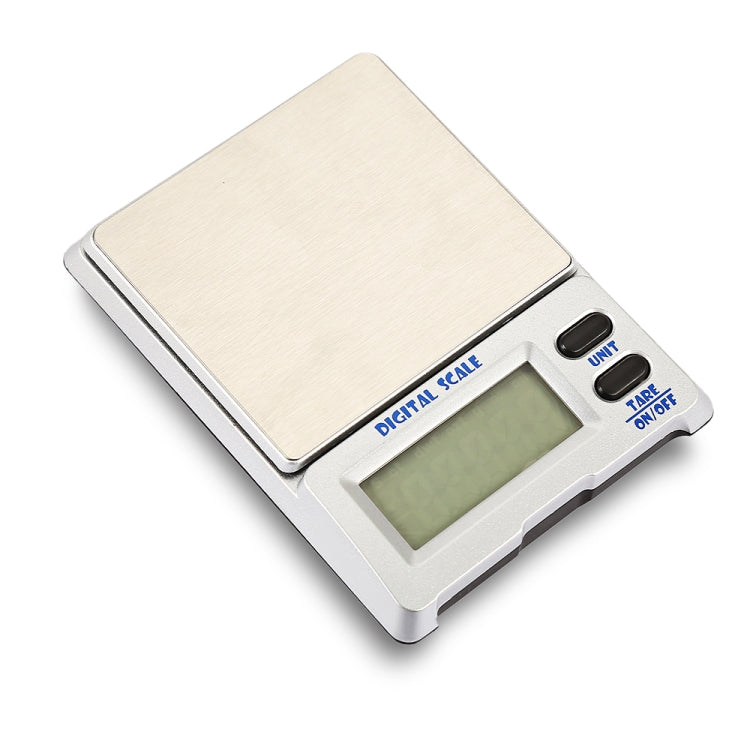 Digital jewelry scale close-up with wood platform, LCD screen, unit and tare controls