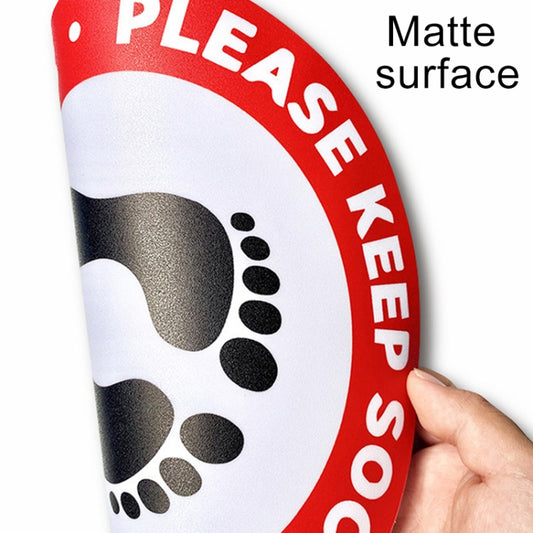 Round social distance floor sticker detail with matte surface finish and red border