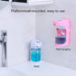 Pink wall-mounted automatic soap dispenser with blue liquid reservoir