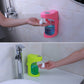 Pink and green wall-mounted automatic soap dispensers dispensing foam