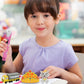 Hand-held 3D printing pen, pink, held by a child with nozzle and grip visible