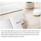 Mini portable color ink printer held near white paper on desk