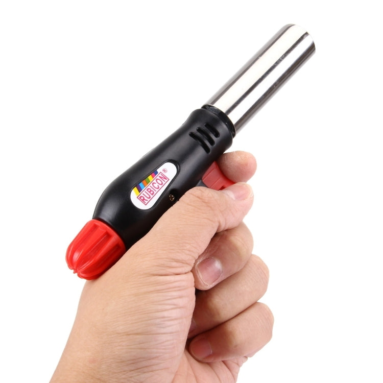 Handheld gas blow torch with black body and red nozzle, close-up in hand