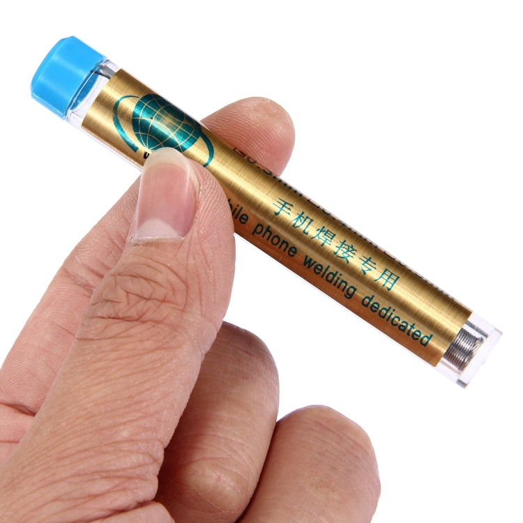 0.3mm solder wire flux core held in hand, gold tube with blue end cap